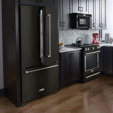 black stainless steel appliances with black cabinets|kitchen countertops with black appliances.